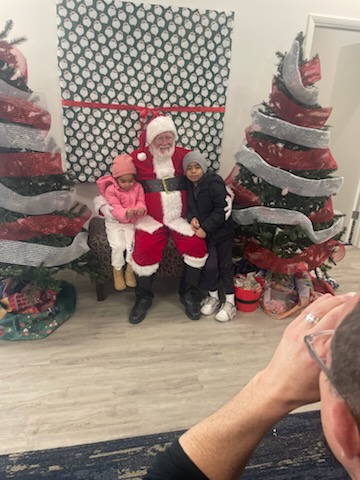 Children meeting Santa in Denver at VOA’s mission 